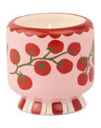 Ceramic candle holder with tomato design on a white background