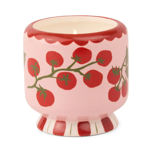 Ceramic candle holder with tomato design on a white background